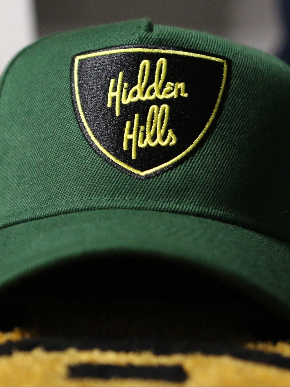 Green Baseball Cap with Yellow Patch